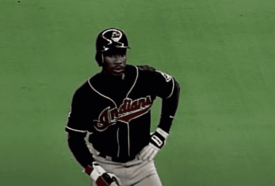 Kenny Lofton stealing a base, showcasing his impact on baseball speed.